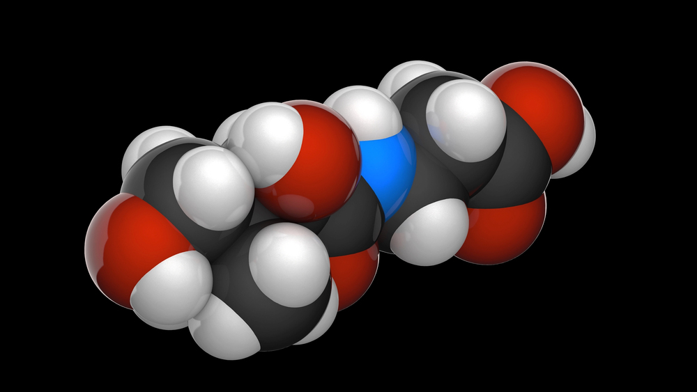 3D space-filling molecular model of adrenaline (epinephrine) showing carbon, oxygen, nitrogen, and hydrogen atoms on black ba